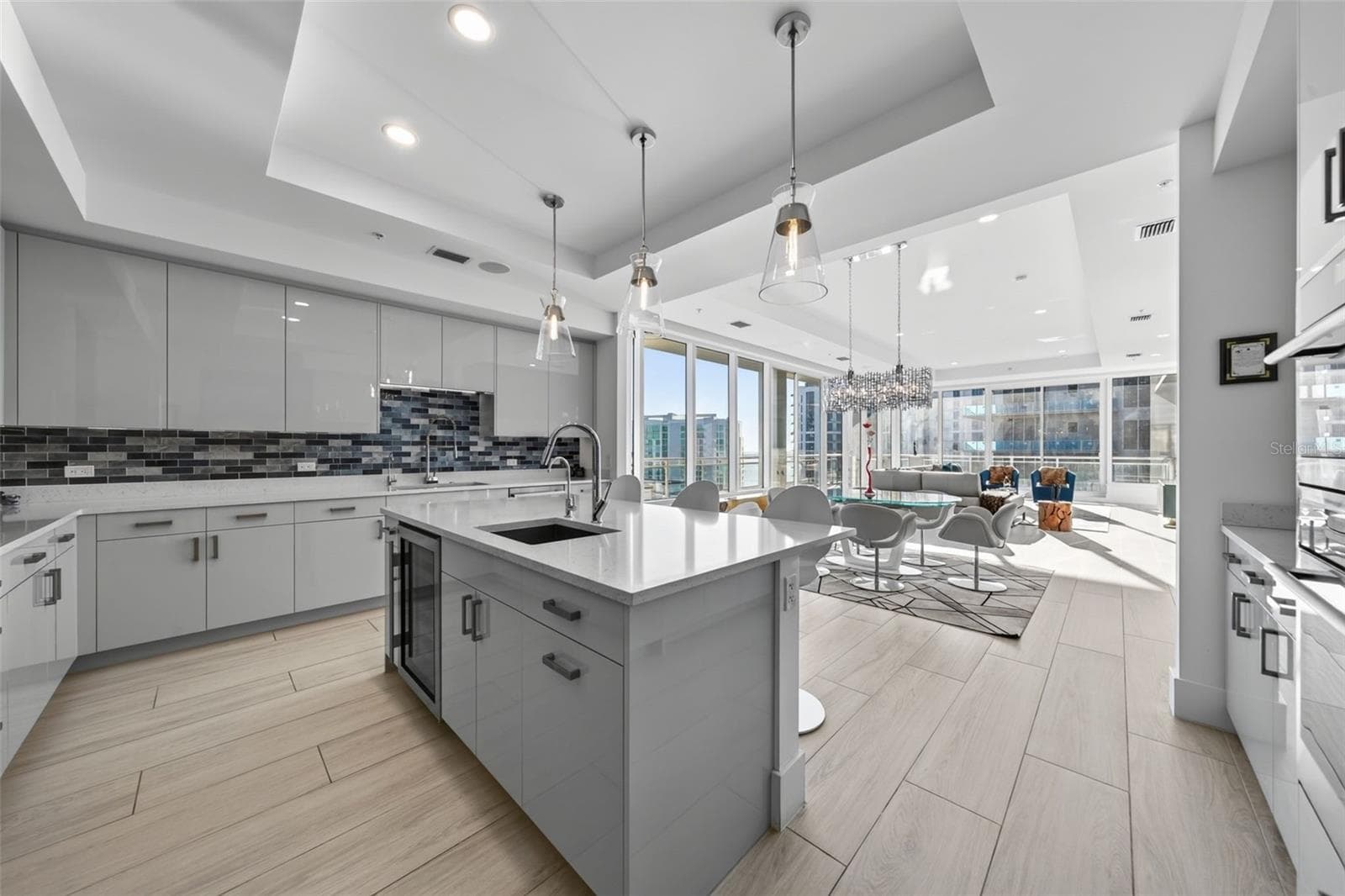 Kitchen with Island Featuring a Wine Refrigerator - 540 N TAMIAMI TRL #1604, SARASOTA