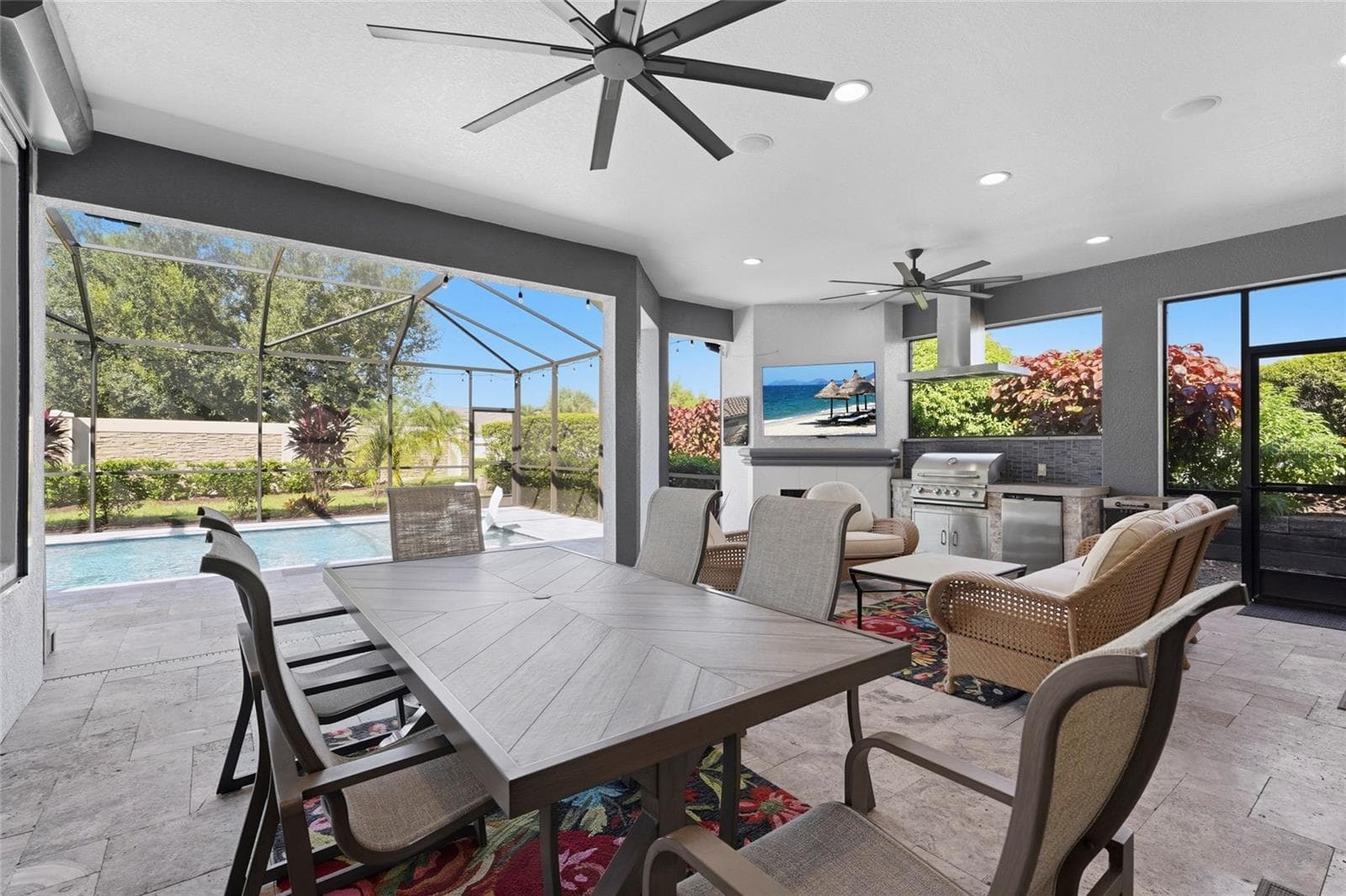 Outdoor lanai area with ample seating room plus outdoor kitchen - 13227 PALERMO DR, BRADENTON