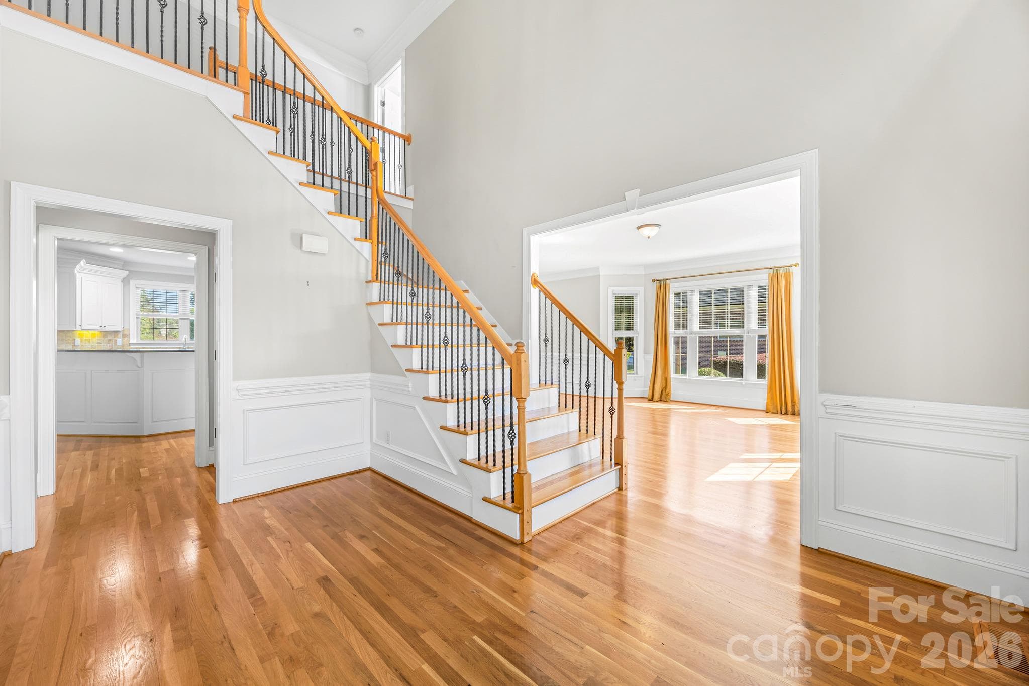 Foyer View with crown molding and wainscoting(foyer,dining, and sitting areas) - 105 Mandarin Drive, Mooresville