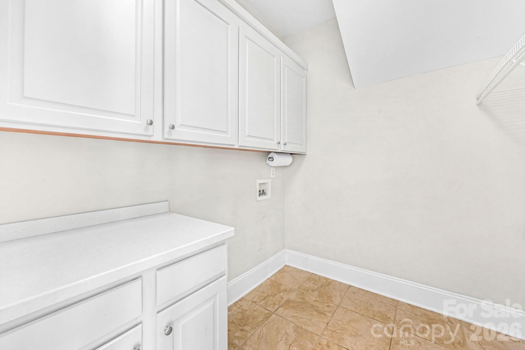 Laundry Room on Main with cabinets and counter space for folding clothes,etc. - 105 Mandarin Drive, Mooresville