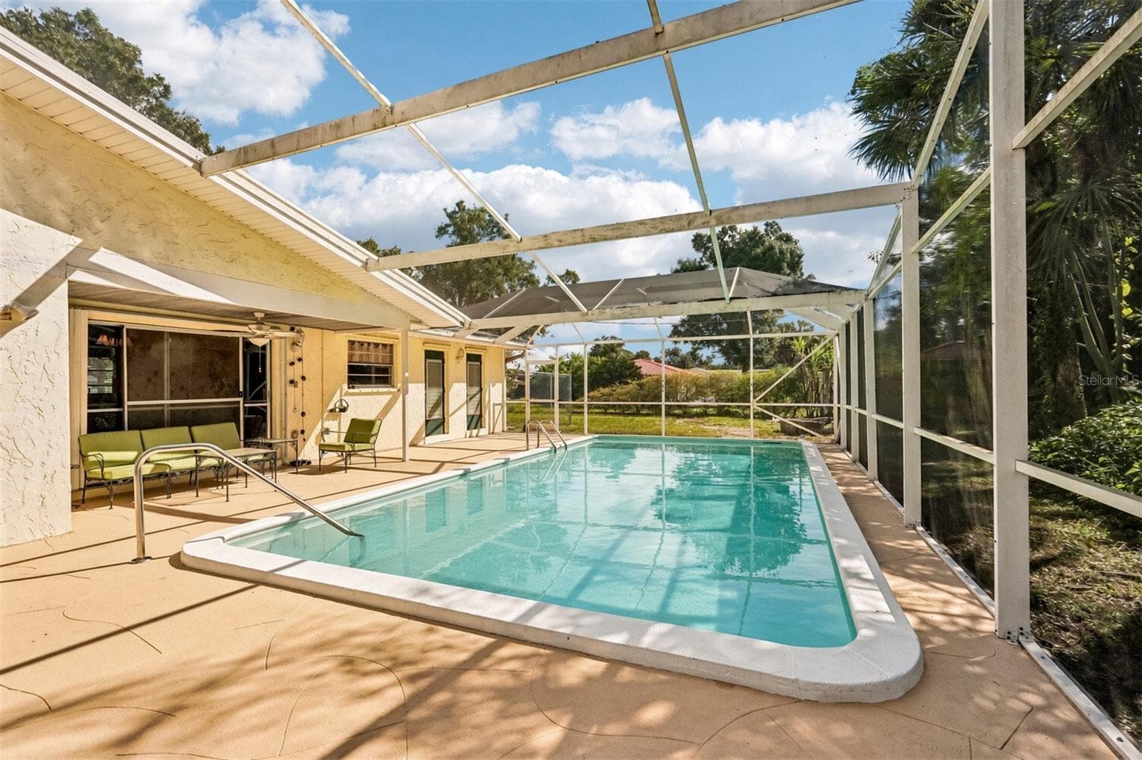 Screened lanai and covered seating area - 22215 ONEIDA AVE, PORT CHARLOTTE