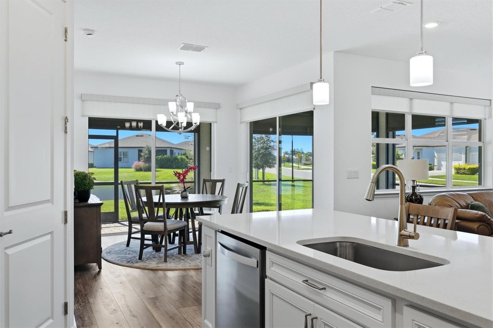 Electric shades on sliders and lanai for privacy and light control - 10635 WYNWARD WAY, PARRISH