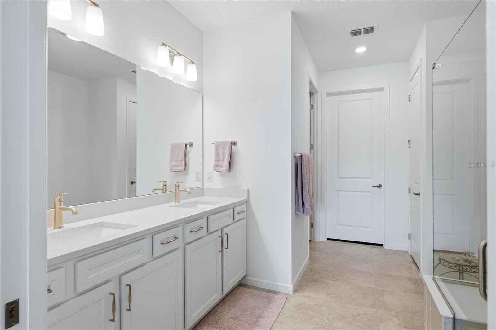 Primary Bath with double sinks, separate room for commode, walk in closet and linen closet. - 10635 WYNWARD WAY, PARRISH