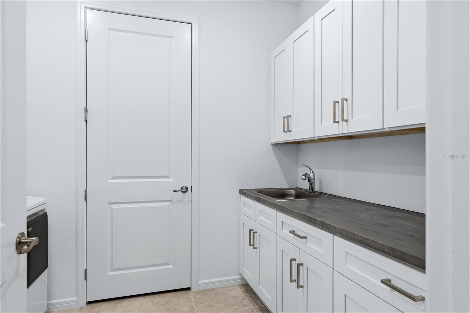 Huge laundry room with lots of workspace and custom cabinetry & countertop - 10635 WYNWARD WAY, PARRISH