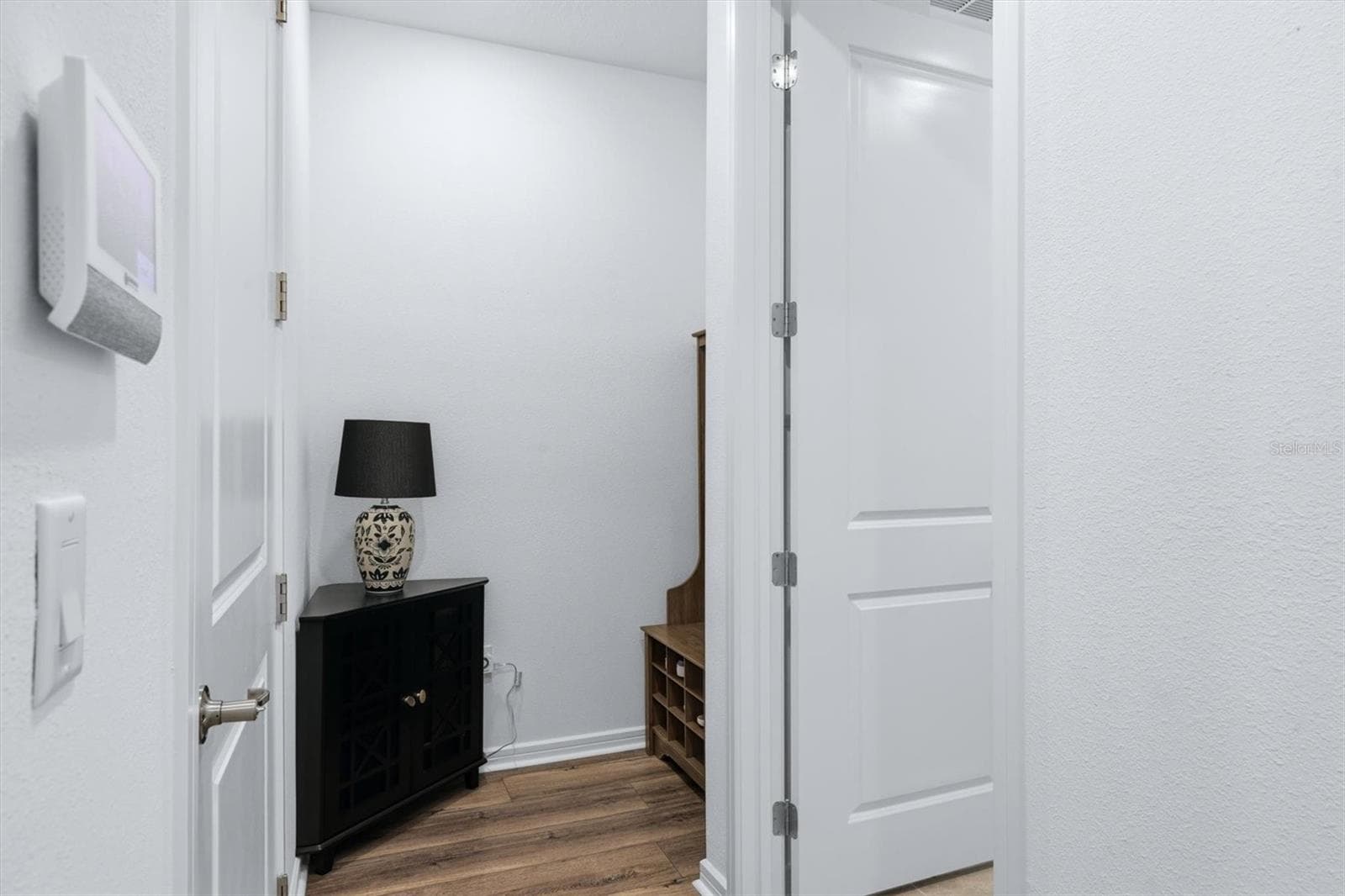 A mudroom area tucked away inside garage door entry - 10635 WYNWARD WAY, PARRISH