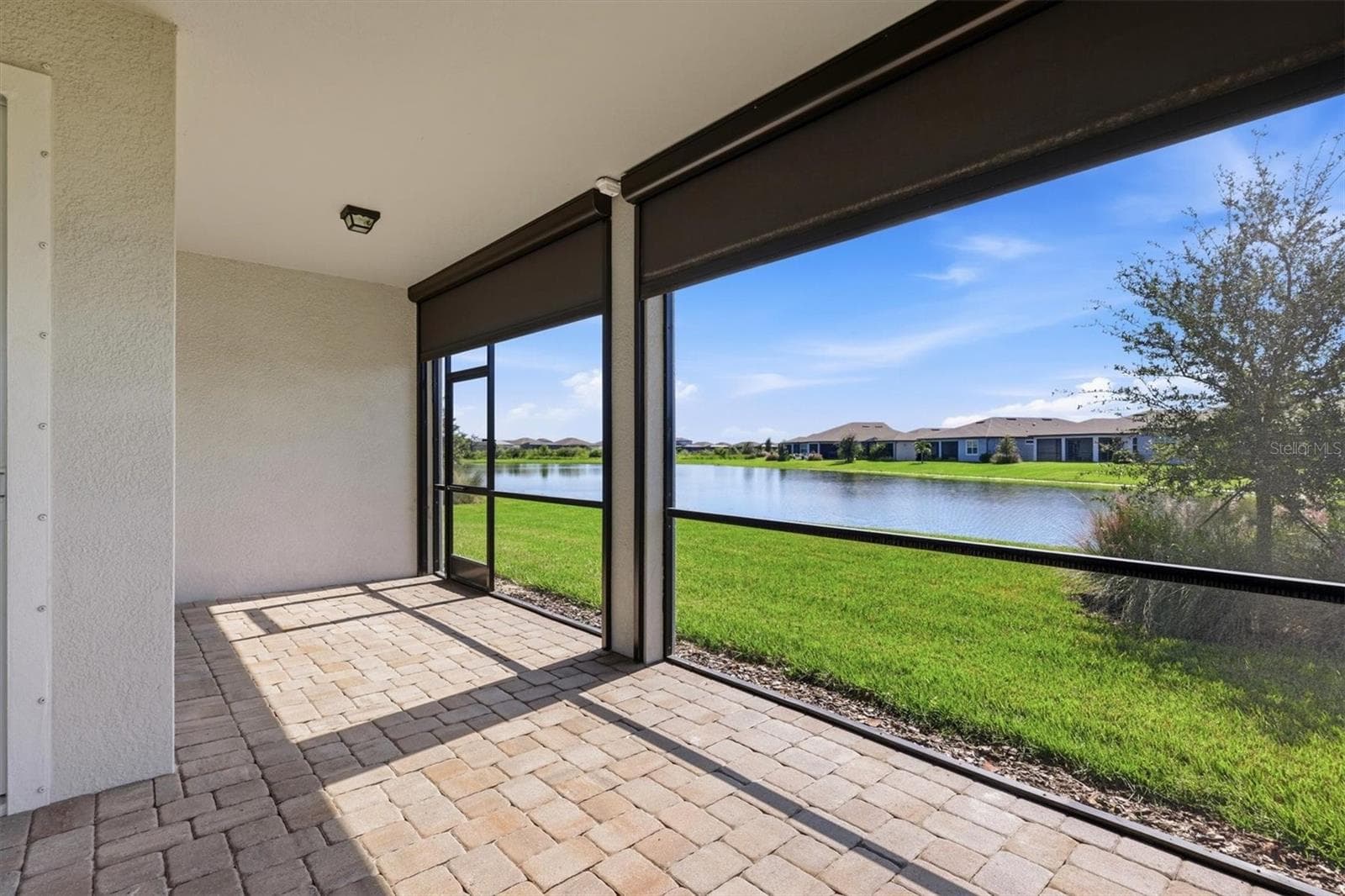 Electric shades for light and wind control - 10635 WYNWARD WAY, PARRISH