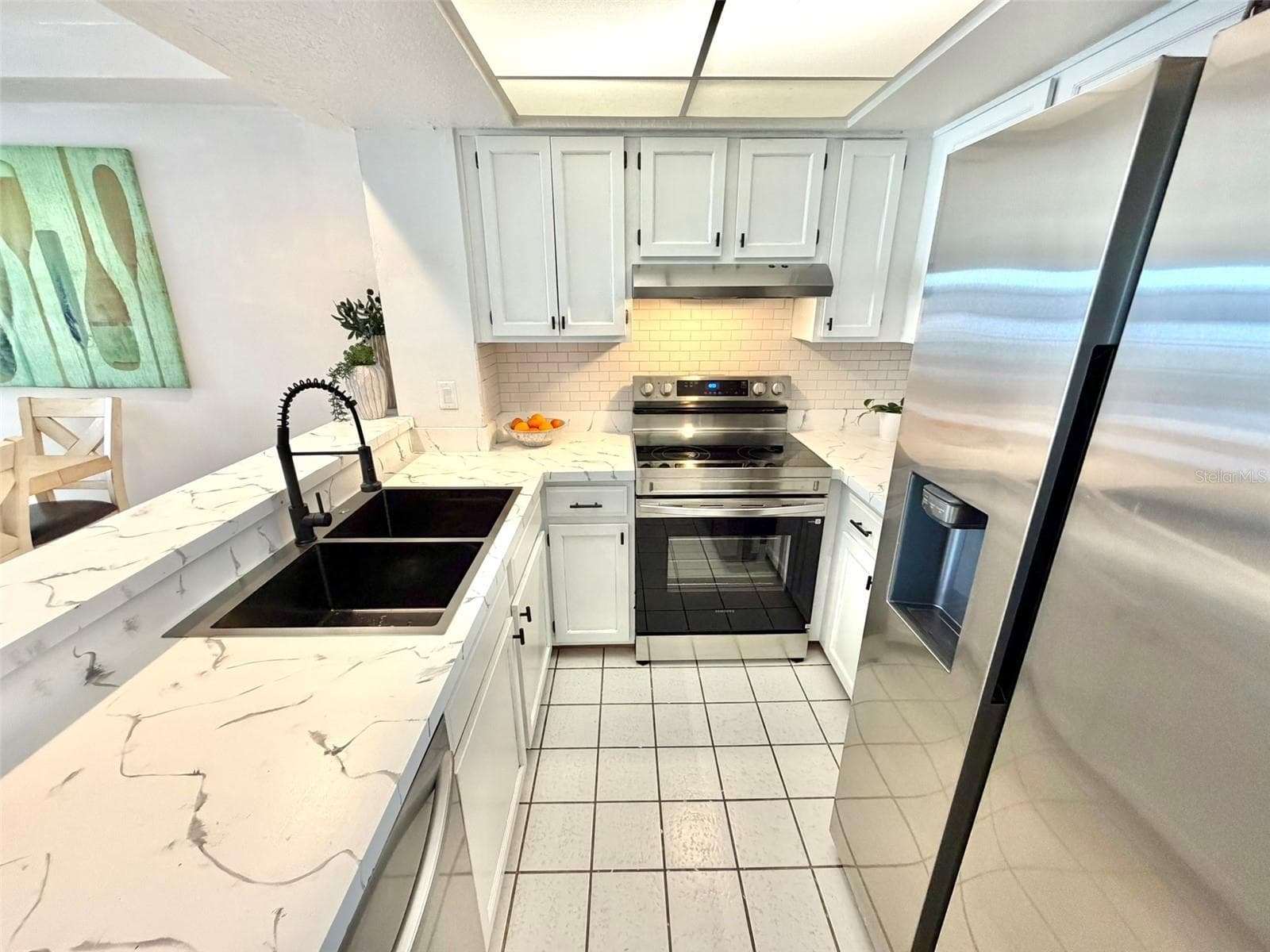 Open kitchen with Breakfast Bar. - 19201 VISTA LN #D2, INDIAN SHORES