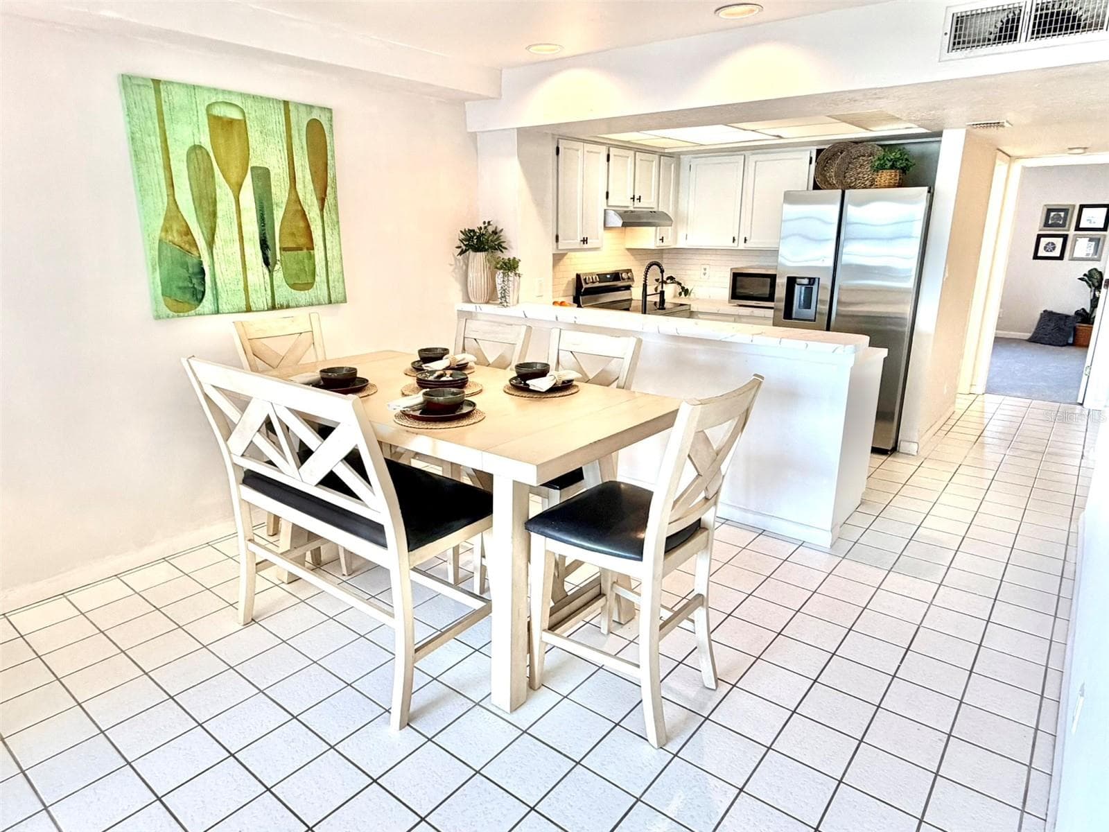 Open Concept Kitchen with Breakfast Bar and Flexible Space Dining Area - 19201 VISTA LN #D2, INDIAN SHORES