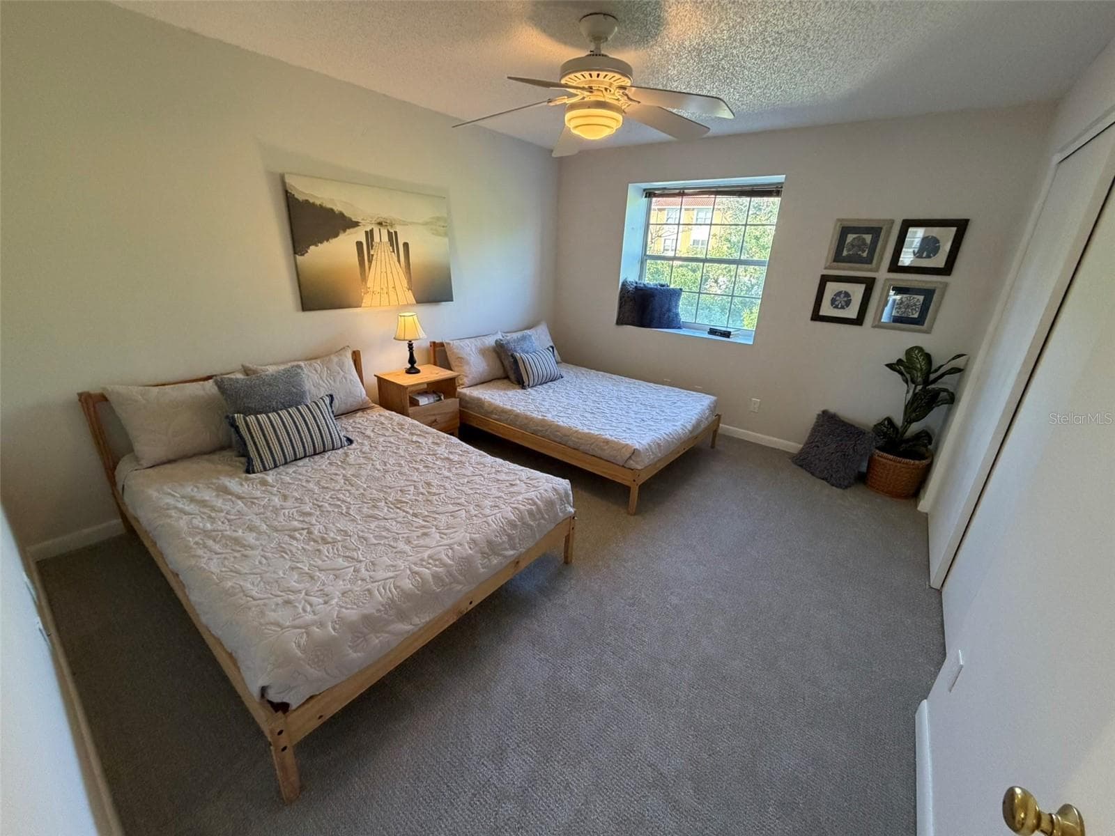 Third Bedroom on Main Living Level currently set up with two Queen beds. - 19201 VISTA LN #D2, INDIAN SHORES