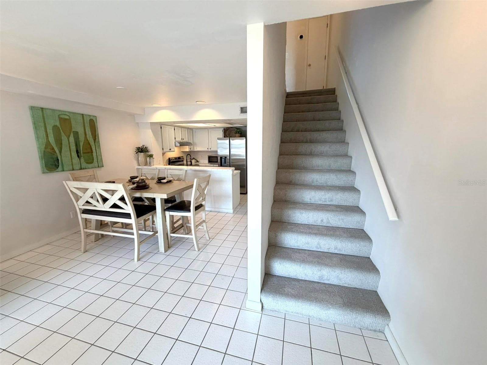 Head upstairs to the Primary and Second Suite. - 19201 VISTA LN #D2, INDIAN SHORES