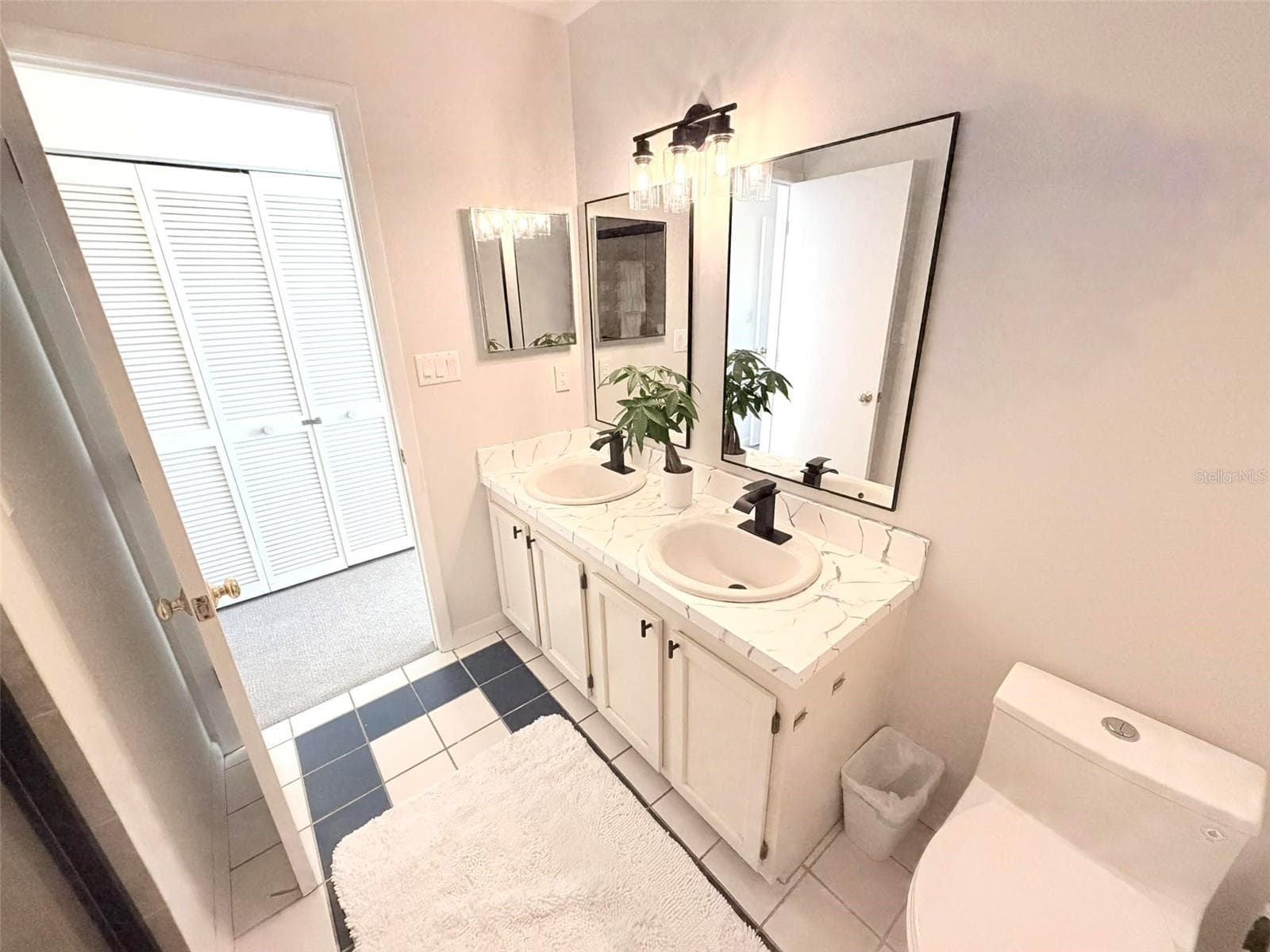 Primary Ensuite Bath with double vanity and sinks. - 19201 VISTA LN #D2, INDIAN SHORES