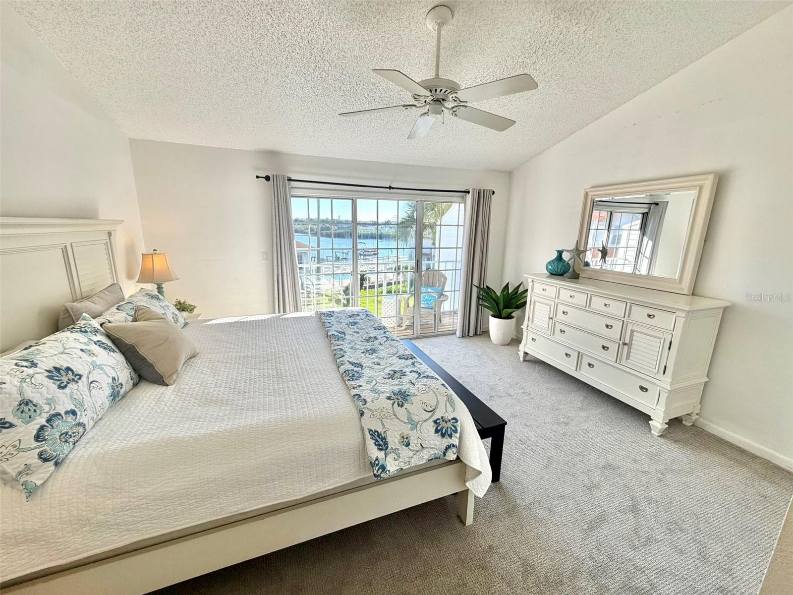 Primary Suite on the Upper Level With Waterview from Private Deck. - 19201 VISTA LN #D2, INDIAN SHORES