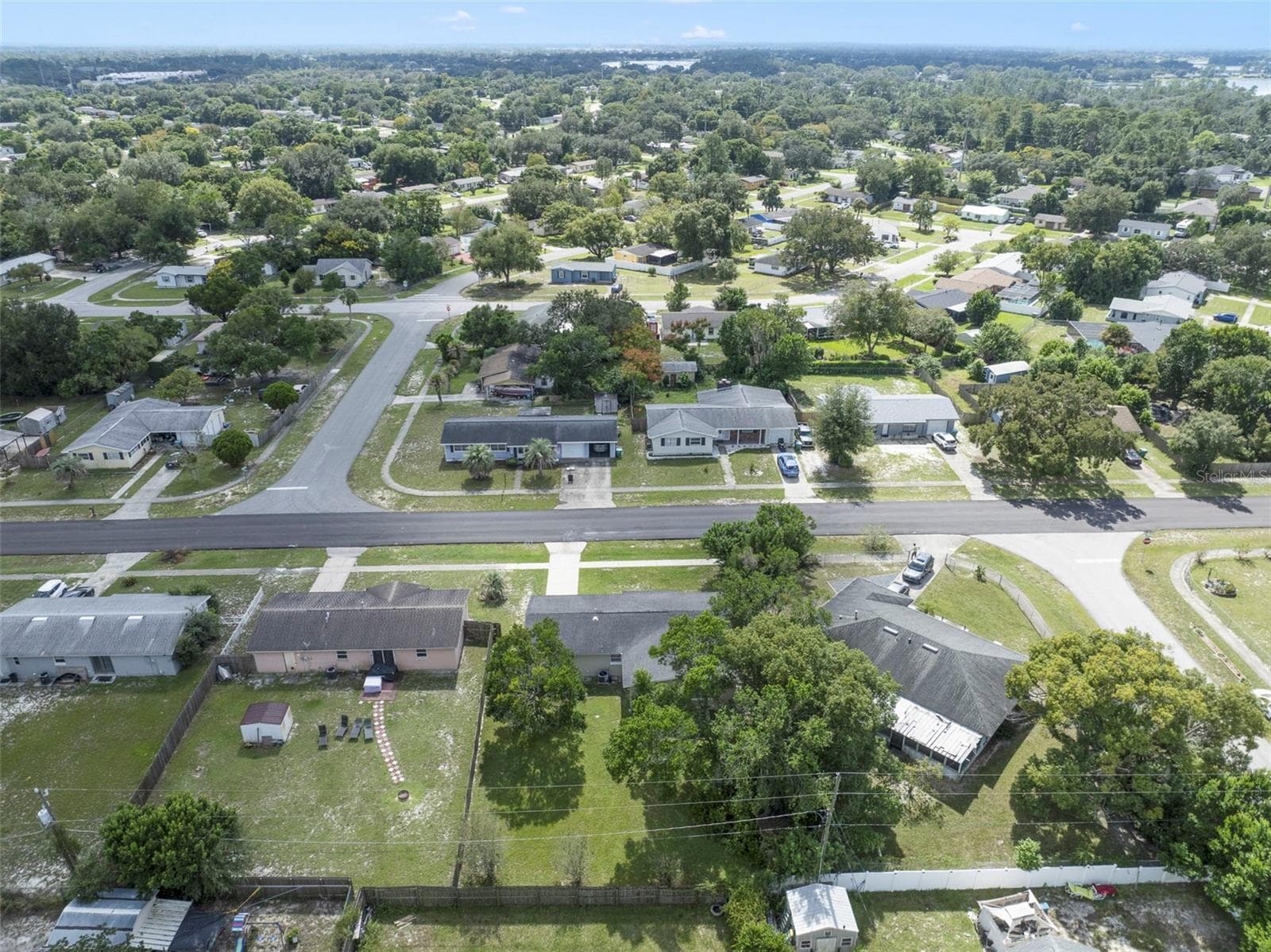 Drone shot of the property and the yard - 2638 BEAL ST, DELTONA