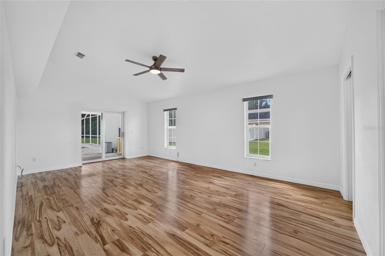 Primary Bedroom with private access out to the pool - 7558 SW 103RD LOOP, OCALA
