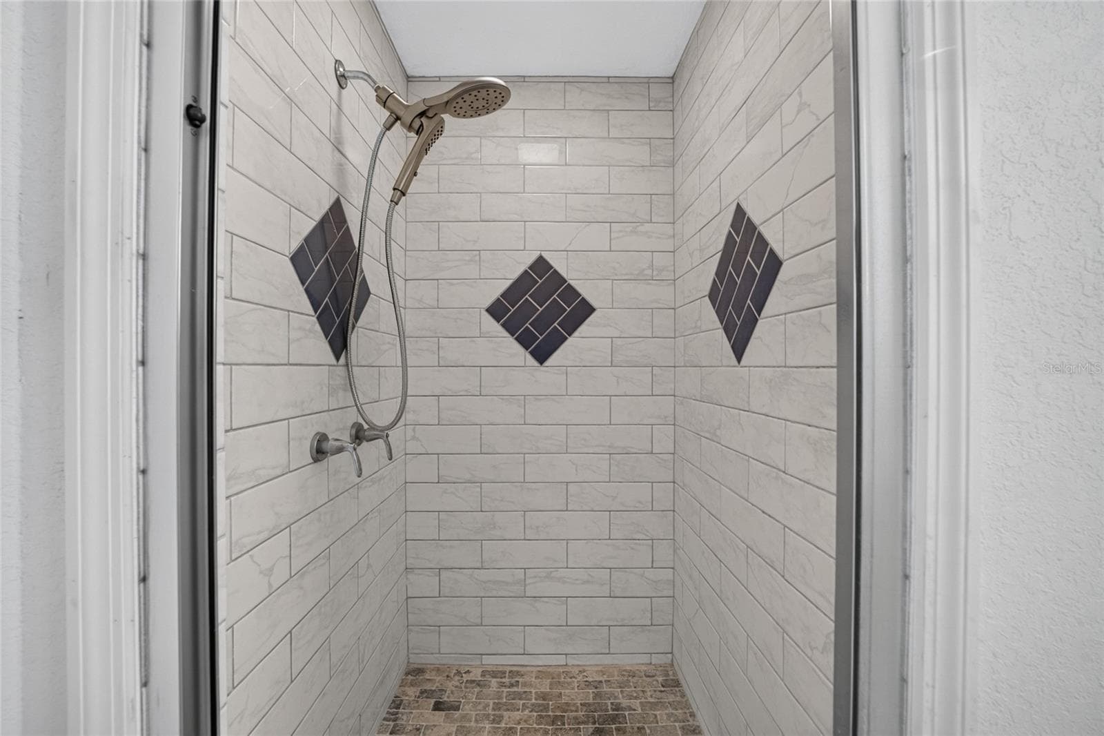 Premium tile and fixtures in the renovated walk in shower - 7558 SW 103RD LOOP, OCALA