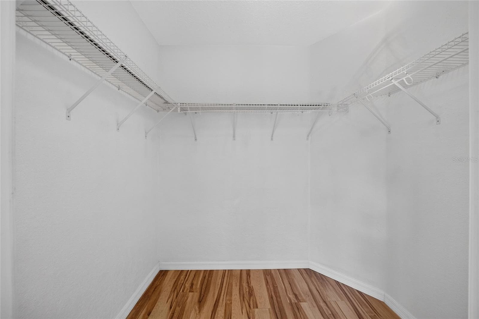 Expansive walk in closet in the primary bedroom - 7558 SW 103RD LOOP, OCALA