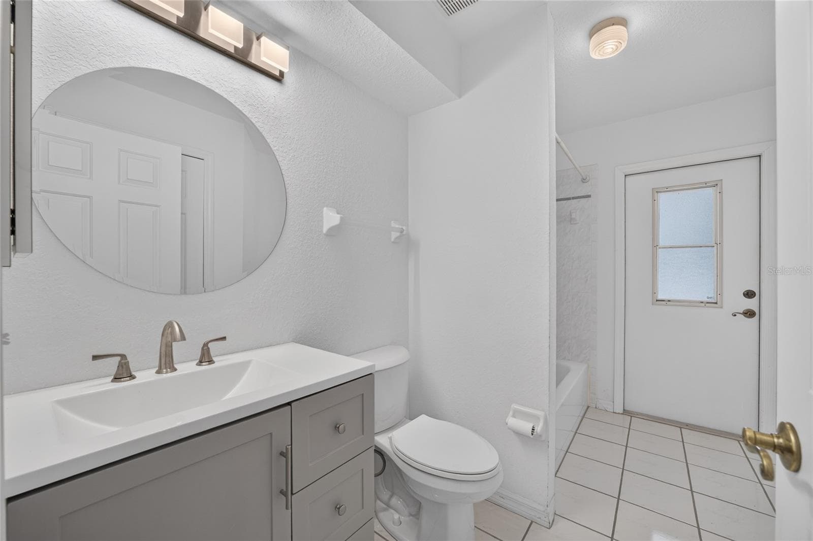 New cabinetry, Granite counters with decorative mirror - 7558 SW 103RD LOOP, OCALA