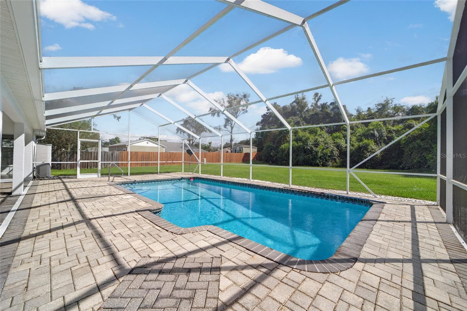 Premium pavers have been added to the pool deck - 7558 SW 103RD LOOP, OCALA