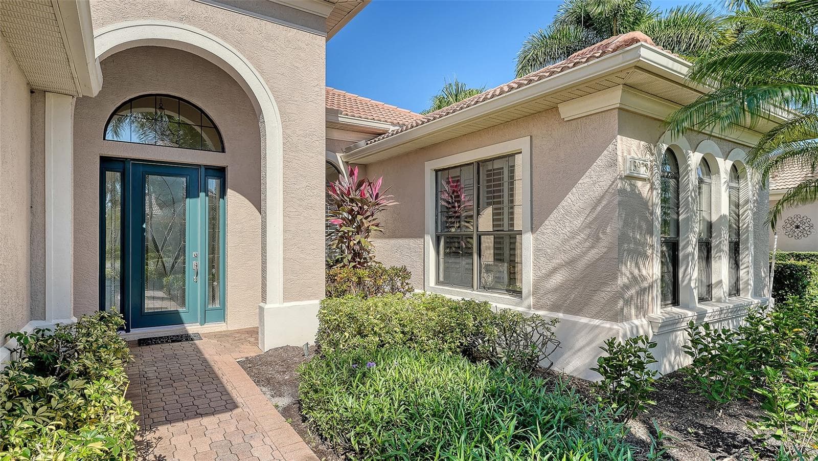 Newer hurricane impact decorative front door. - 13978 SIENA LOOP, LAKEWOOD RANCH