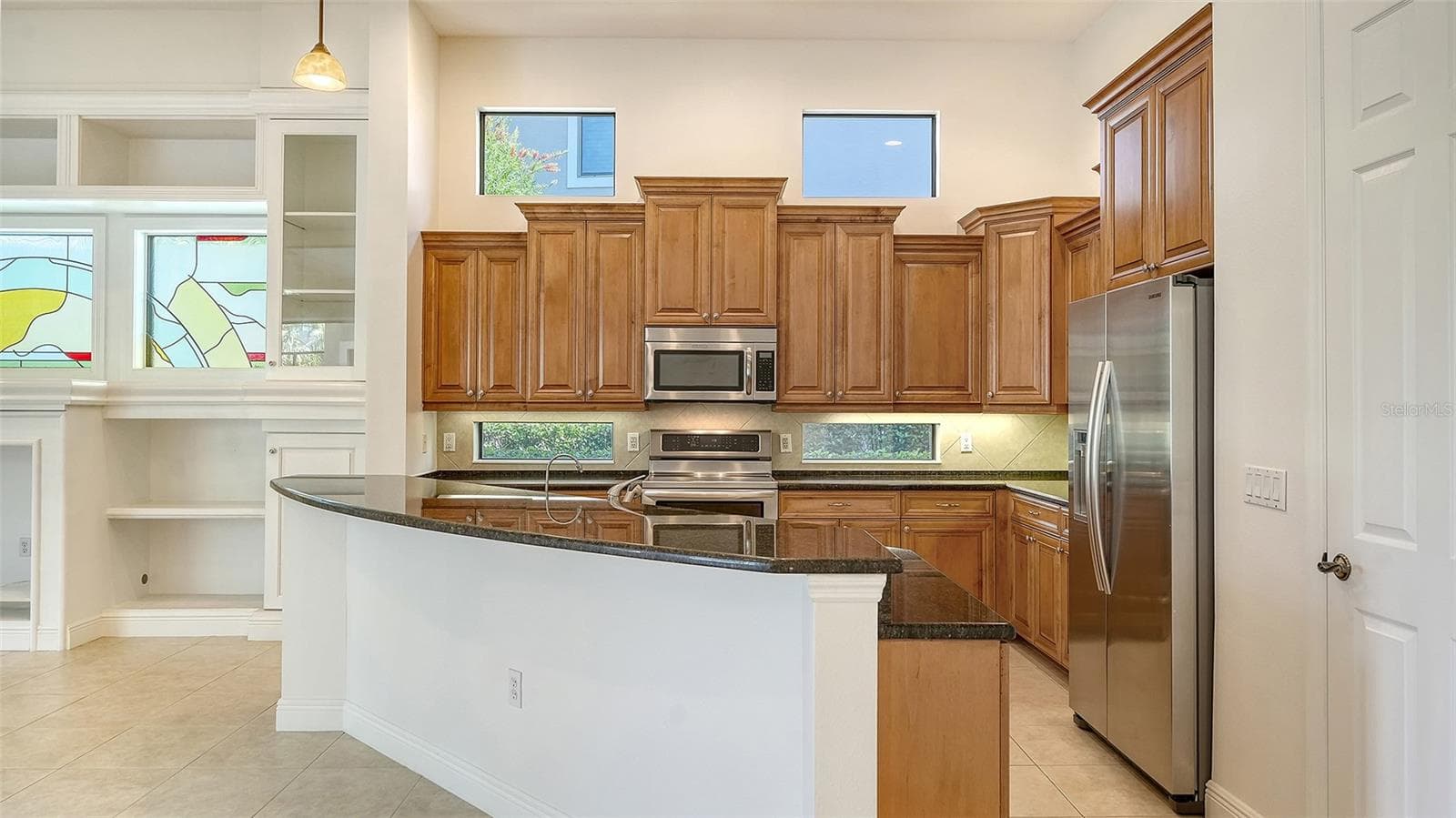 Spacious kitchen with newer appliances including an induction range. - 13978 SIENA LOOP, LAKEWOOD RANCH