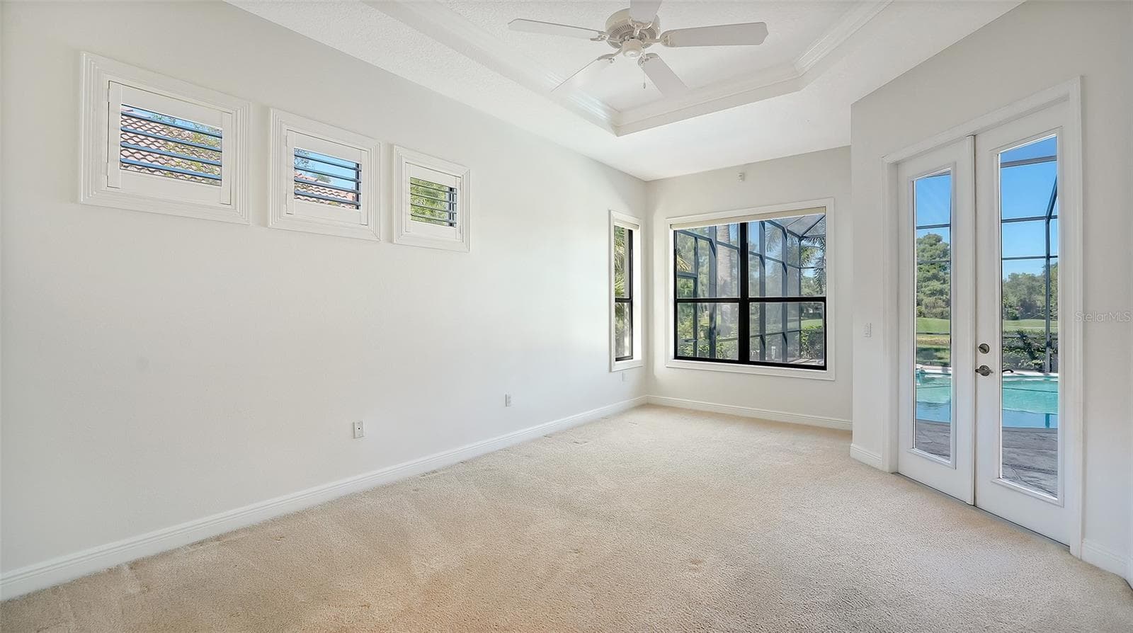 Master bedroom with lots of natural light and double french door to the lanai - 13978 SIENA LOOP, LAKEWOOD RANCH