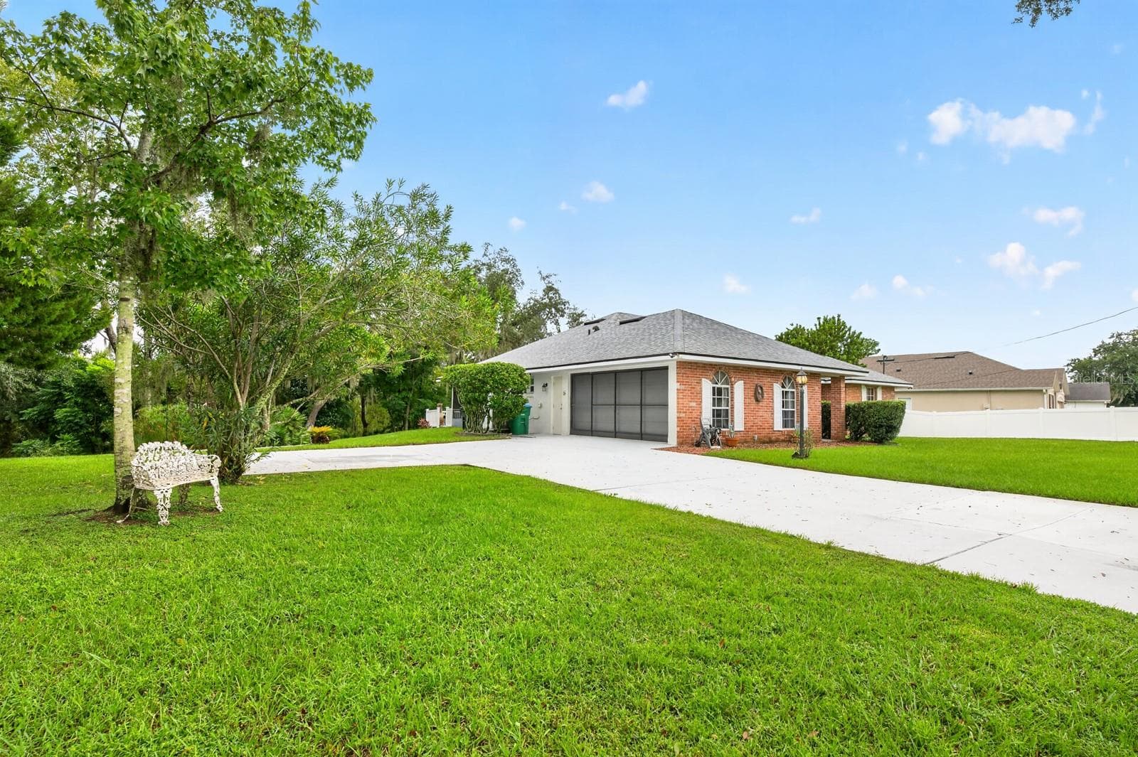 Situated in a HIGH AND DRY LOCATION, the home boasts GREAT CURB APPEAL with attractive brick facing. - 2163 NEWMARK DR, DELTONA