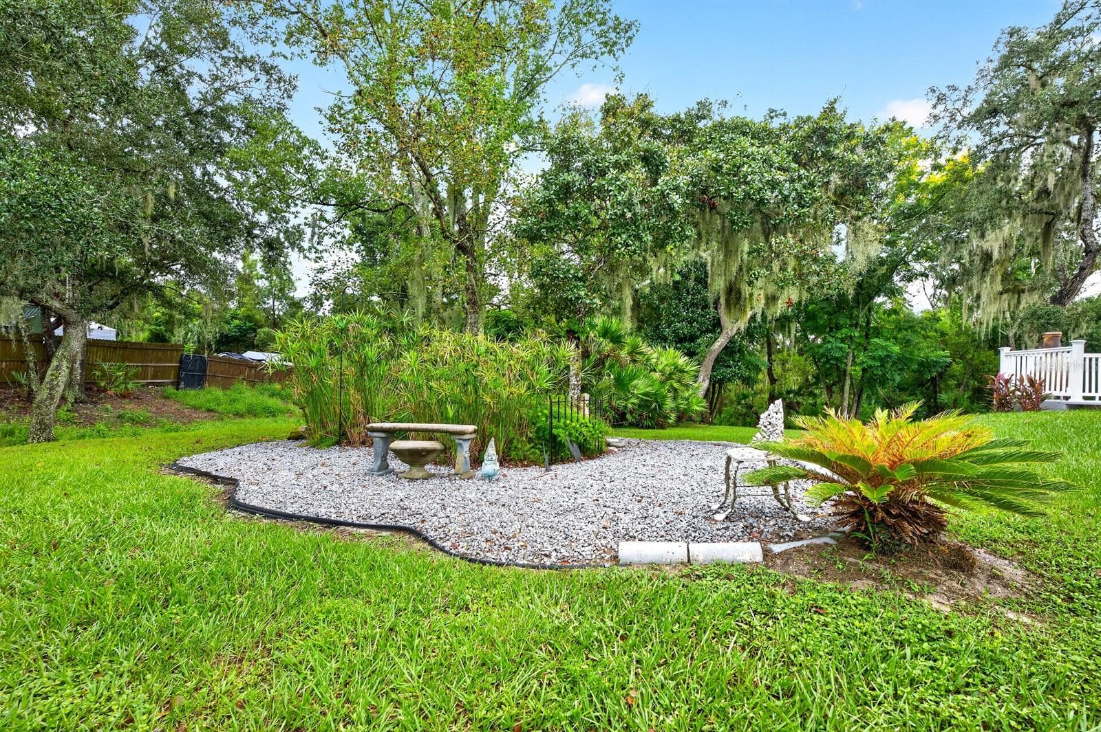 A small GARDEN AREA along the side yard has its own ELECTRICAL OUTLET, adding convenience for gardening projects or other outdoor uses. - 2163 NEWMARK DR, DELTONA
