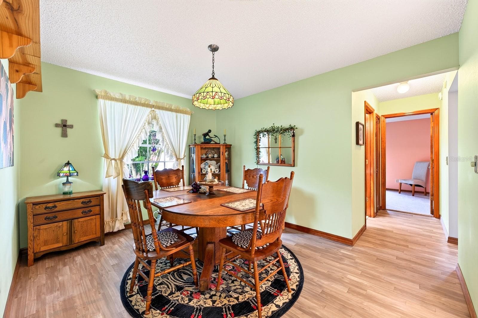 A FORMAL DINING ROOM provides a dedicated space for hosting dinners and special occasions. - 2163 NEWMARK DR, DELTONA