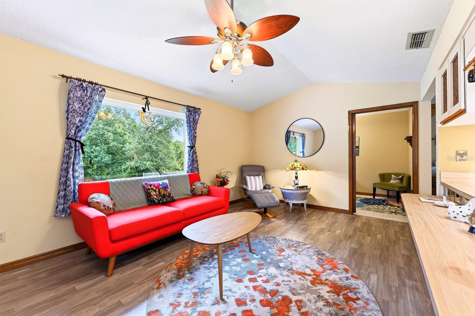 A large NEW PICTURE WINDOW brings in natural light and enhances the Family Room's welcoming atmosphere. - 2163 NEWMARK DR, DELTONA