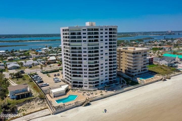 The property is set in a quiet, residential stretch of Daytona Beach Shores, surrounded by colorful beach homes and convenient local amenities. - 3855 S ATLANTIC AVE #401, DAYTONA BEACH
