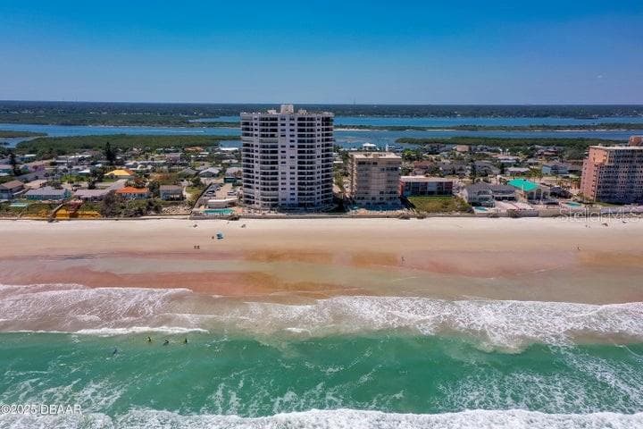 Nestled directly on the sand, this high-rise building boasts unobstructed beach access and expansive shoreline views—ideal for beachfront living. - 3855 S ATLANTIC AVE #401, DAYTONA BEACH