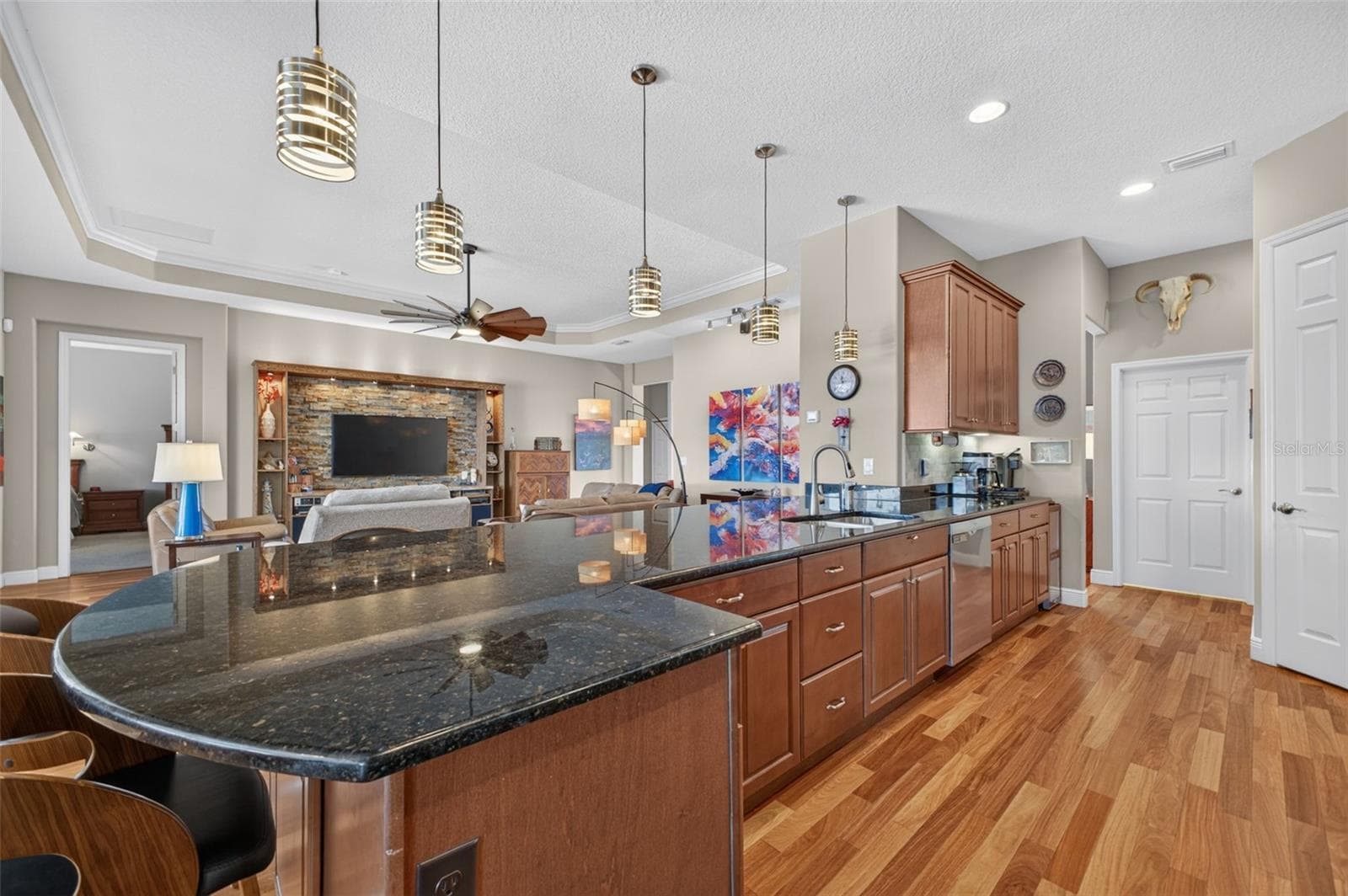 An expansive kitchen peninsula provides generous prep space, perfect for baking, meal prep, or entertaining. - 2444 PAWTUCKET PASS, MOUNT DORA