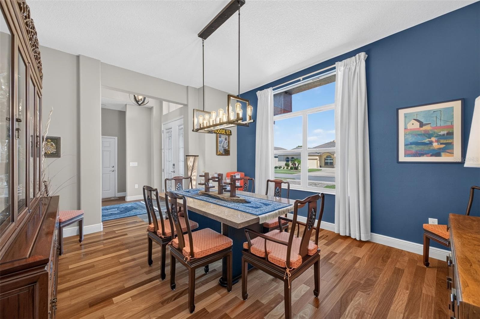 The spacious dining room offers plenty of room to expand your table, making it easy to host family dinners, holiday celebrations, and neighborhood get-togethers. - 2444 PAWTUCKET PASS, MOUNT DORA