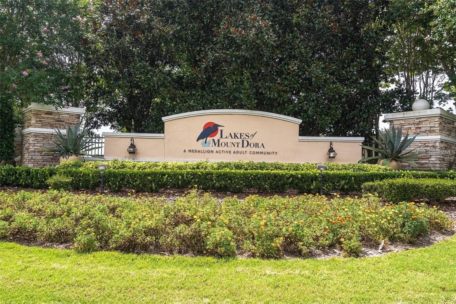 The elegant entrance sign marks the gateway to the highly sought-after Lakes of Mount Dora lifestyle. - 2444 PAWTUCKET PASS, MOUNT DORA