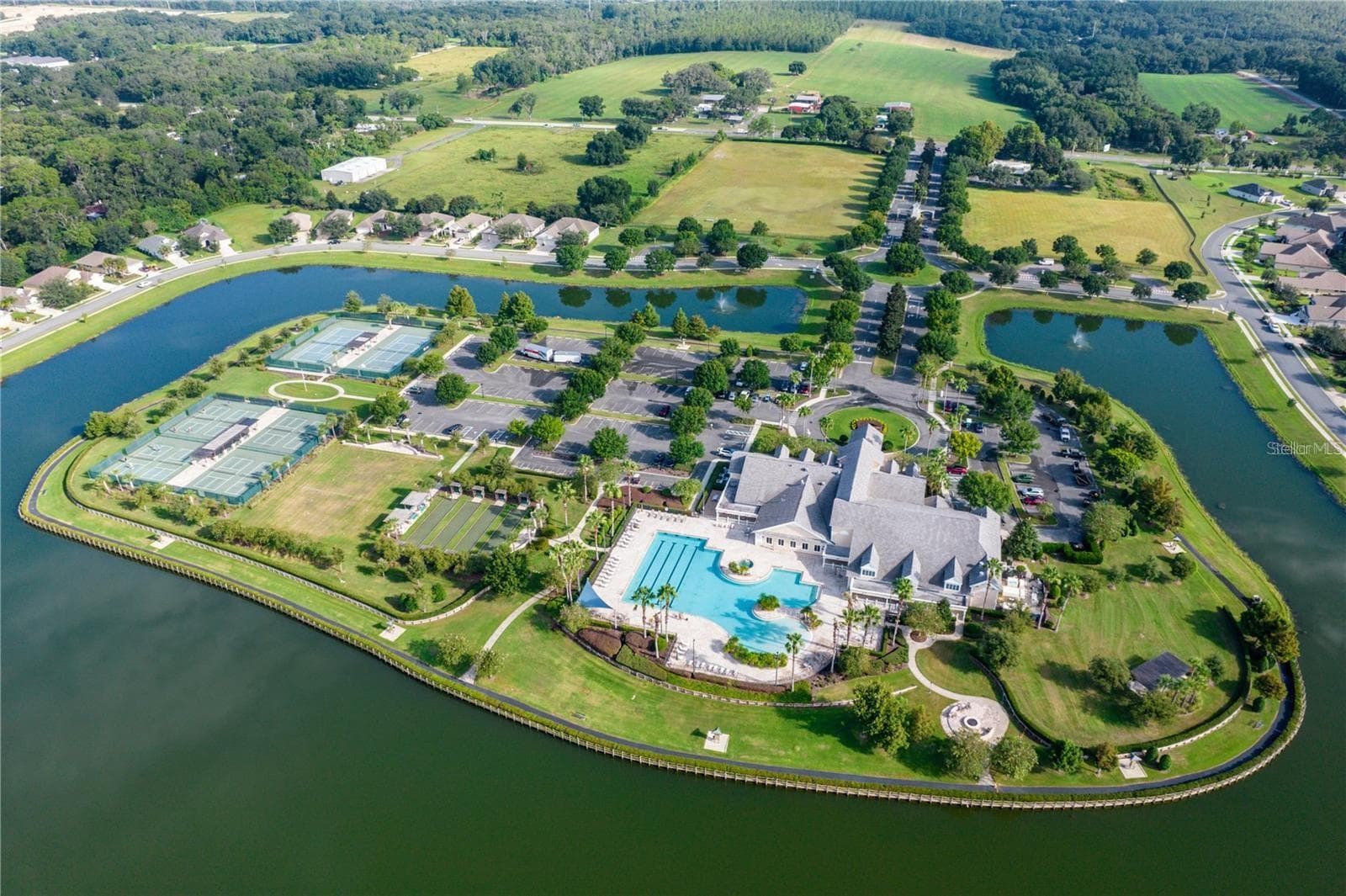 The community’s Activity Peninsula features an array of outdoor recreation amenities surrounded by scenic lake views. - 2444 PAWTUCKET PASS, MOUNT DORA