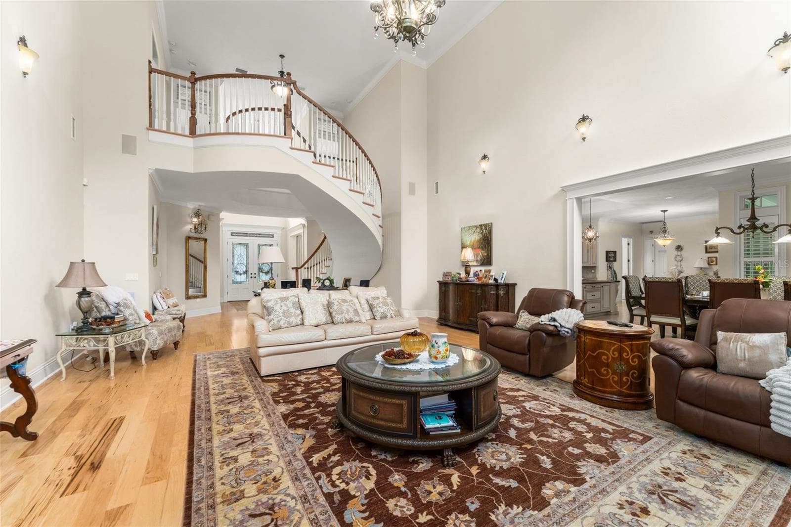 Family room looking back towards foyer & floating staircase - 9691 NW 53RD DR, GAINESVILLE