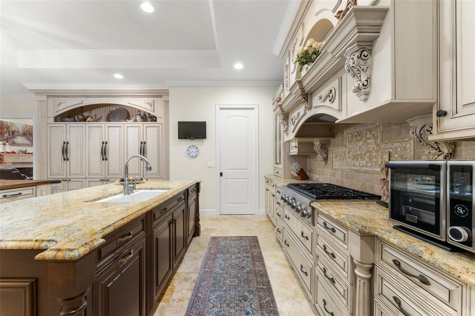 Those aren't cabinets on the far wall, that is the Fridge and freezers - 9691 NW 53RD DR, GAINESVILLE