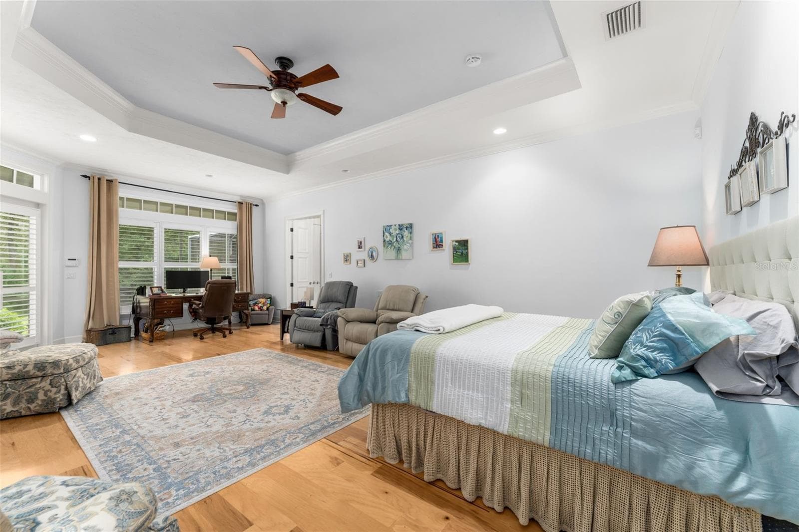 Master bedroom with door leading to back porch - 9691 NW 53RD DR, GAINESVILLE