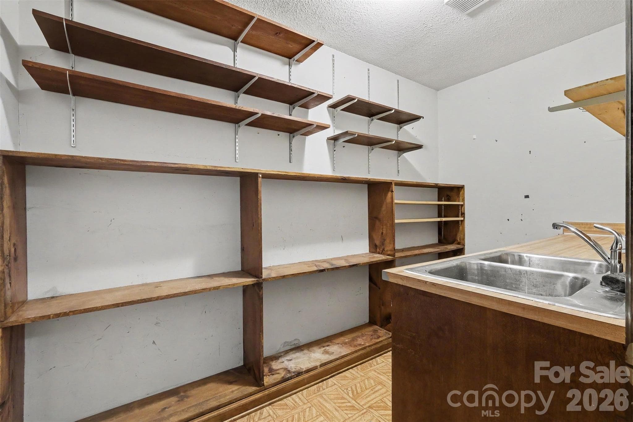 It's a former photography studio with a sink for darkroom work. Could easily be converted to Bathroom 3, if needed. - 102 Roxie Lane, Belmont