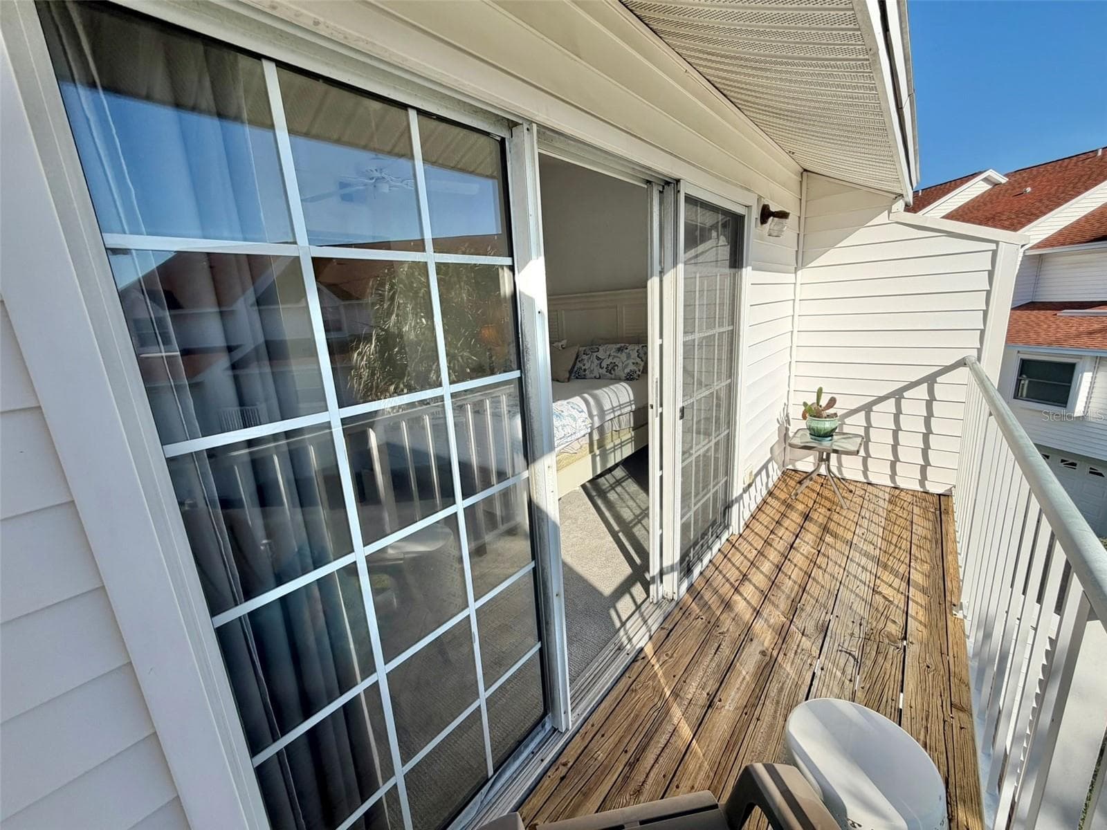 Private Deck off Primary Bedroom with Intracoastal Waterway & Pool views. - 19201 VISTA LN #D2, INDIAN SHORES
