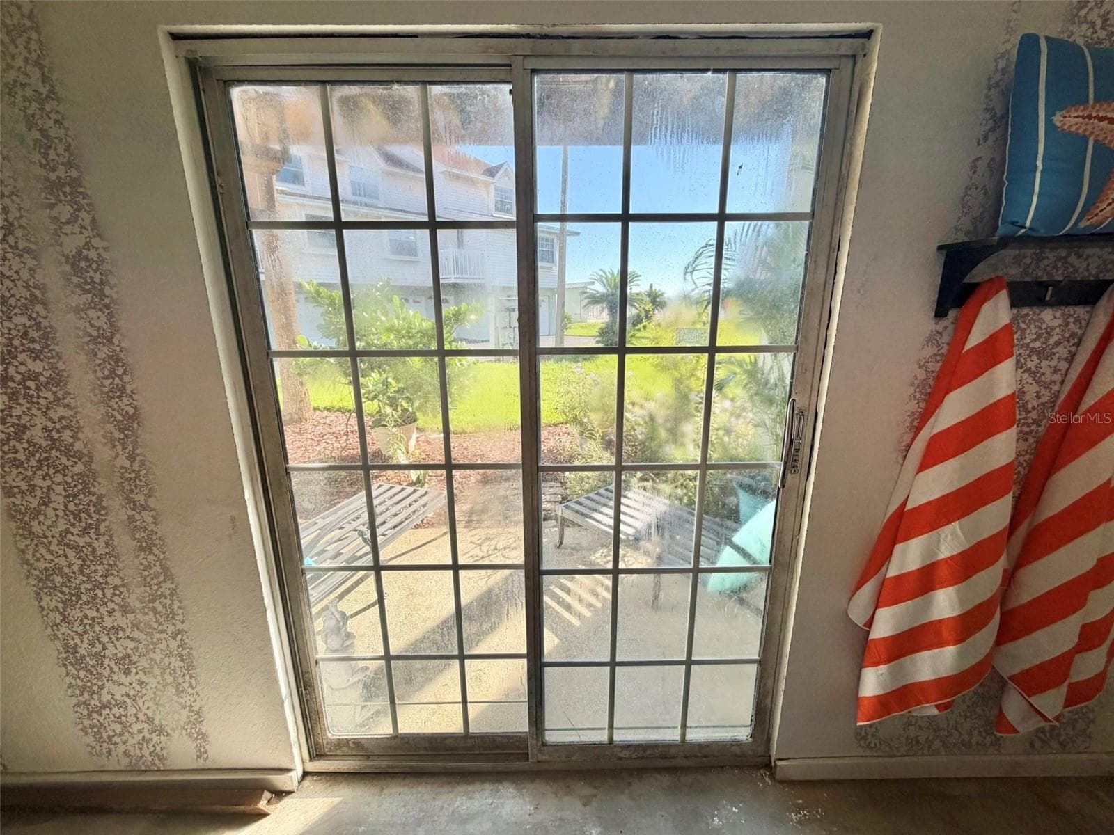 Sliding Doors from the Garage lead to a Private Patio - 19201 VISTA LN #D2, INDIAN SHORES
