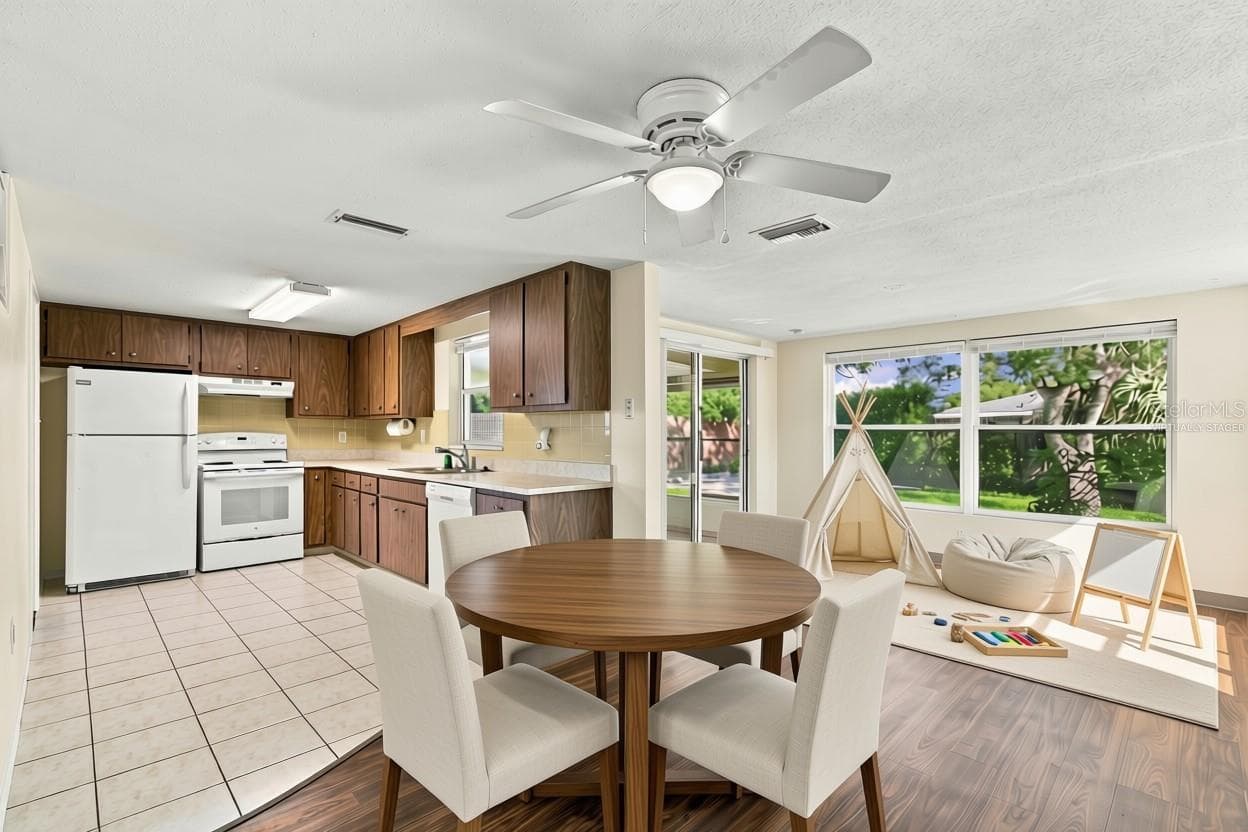 Virtually Staged Kitchen, Dining space and flex space - 7917 MIMOSA DR, PORT RICHEY