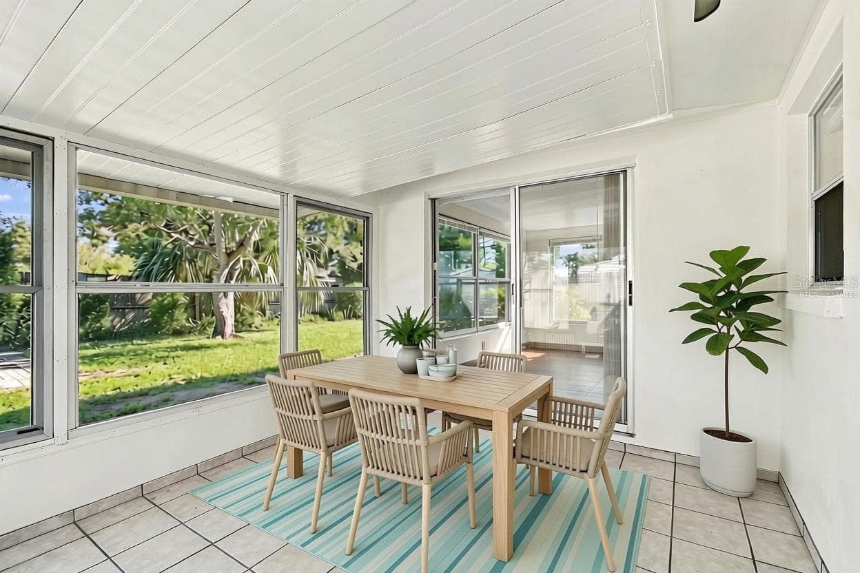 Virtually Staged enclosed lanai - 7917 MIMOSA DR, PORT RICHEY