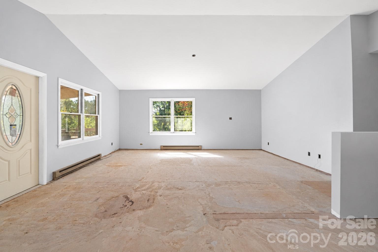 Spacious main living area with abundant natural light and a flexible open layout. - 117 Spivey Mountain Road, Asheville