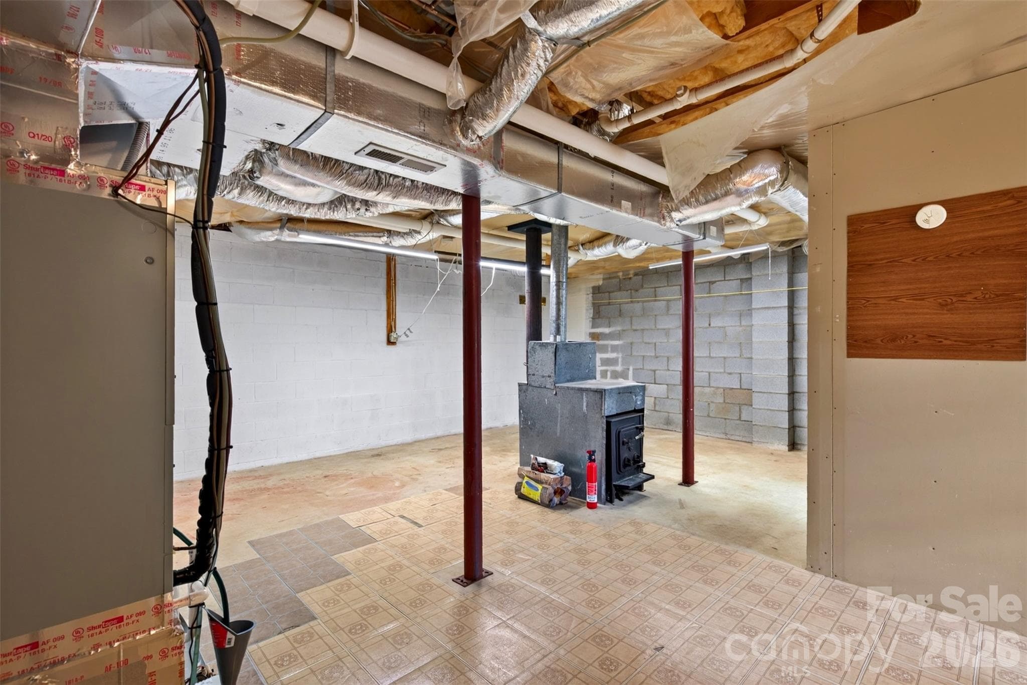 Unfinished Basement with Wood Stove - 126 Pine Hill Drive, Swannanoa