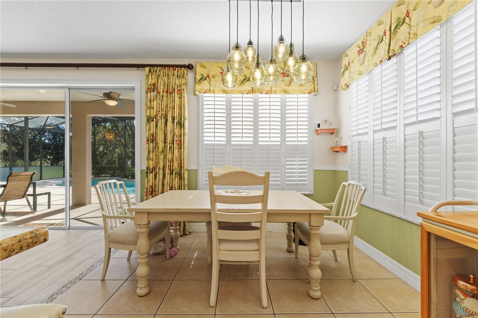 Tinted windows with shutters and window treatments - 4079 GREYSTONE DR, CLERMONT