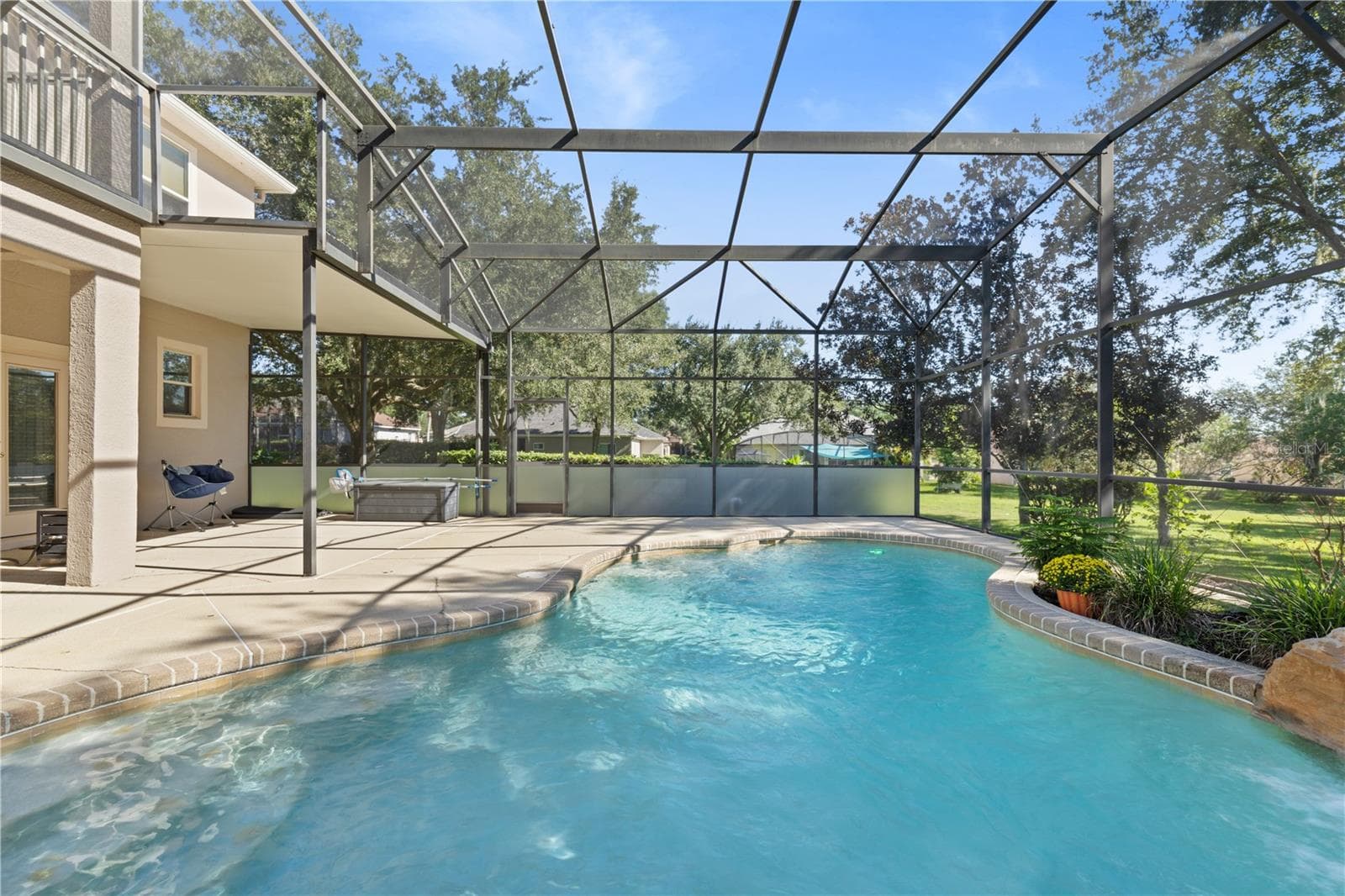 Custom-designed saltwater pool with a beautiful rock waterfal - 4079 GREYSTONE DR, CLERMONT