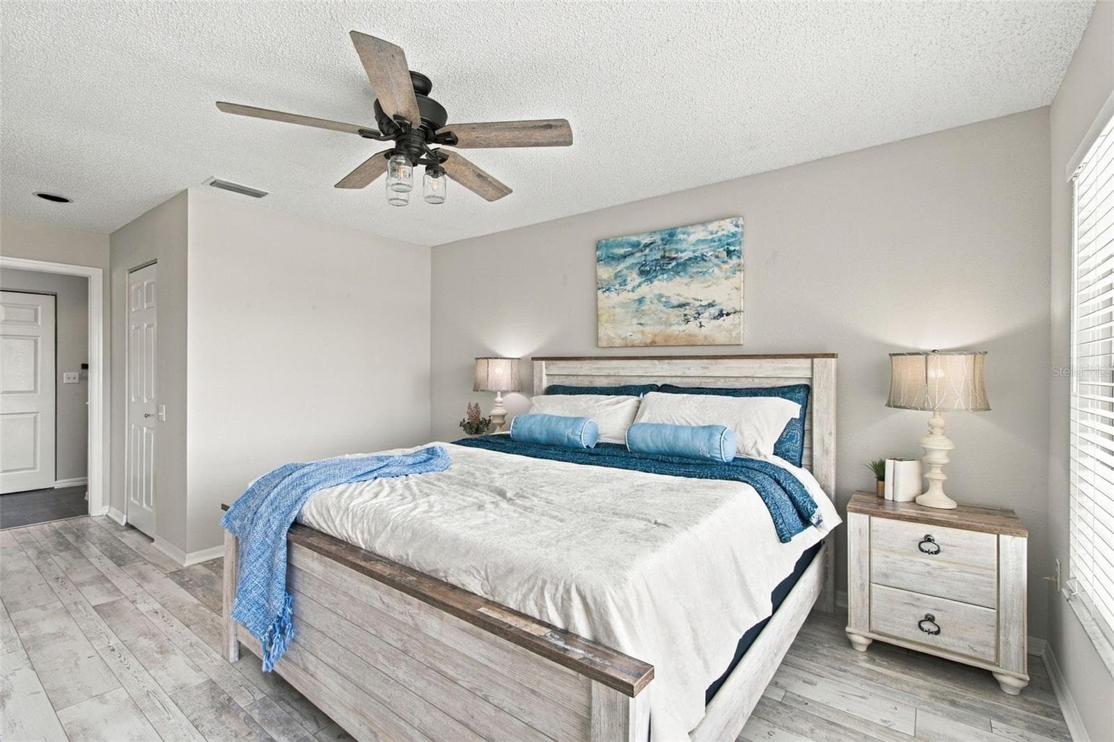 Primary bdrm with en suite bath down hallway. - 4210 CADDIE DR E #202, BRADENTON