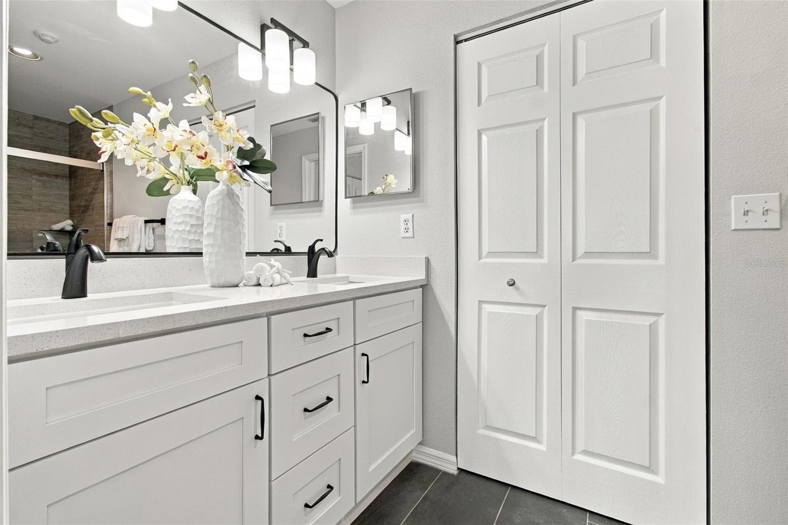 Quartz Countertops, New Fixtures in Black Matte, New Mirror. Linen Closet - 4210 CADDIE DR E #202, BRADENTON