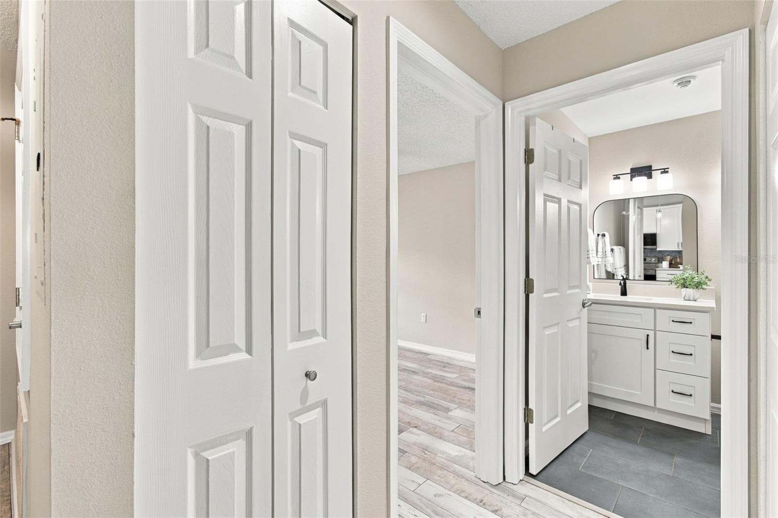 Guest Bath w Custom Vanity w/a Peek into Secondary Bedroom - 4210 CADDIE DR E #202, BRADENTON